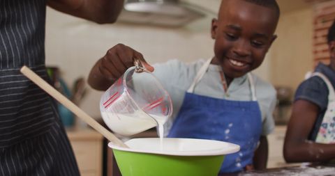 Joyful African American Family Baking in Cozy Kitchen
