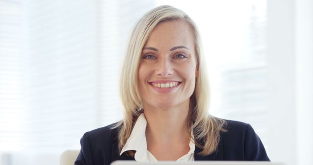 Smiling Businesswoman with Blonde Hair in Office - Download Free Stock Images Pikwizard.com