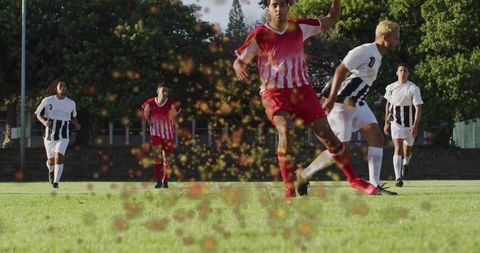 Energetic Soccer Player Kicking Ball with Turf Splashing Around