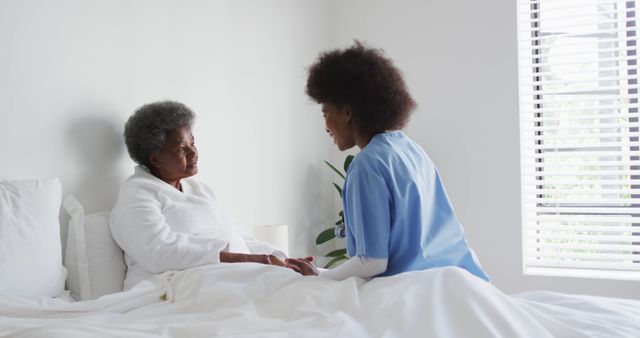 Nurse Providing Support to Senior Woman in Hospital Room - Download Free Stock Images Pikwizard.com