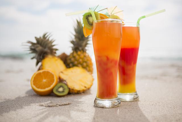 Perfect for use in travel brochures, summer vacation promotions, and advertisements for beach resorts, these vibrant tropical cocktails represent relaxation and enjoyment at the beach. Highlight refreshing beverages and tropical fruits to evoke a sense of paradise and leisure.