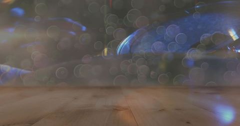 Wooden Tabletop and Colorful Bokeh Lights in Warm Studio Setting