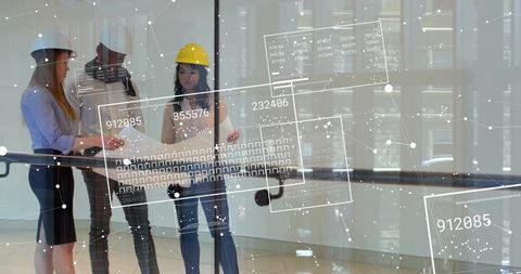 Architects Analyzing Blueprints with Digital Data Overlay