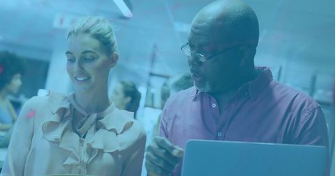 Diverse business professionals collaborating with financial data