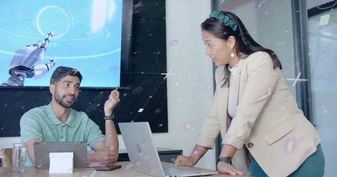 Team Discussing Futuristic Rocket Display in Modern Meeting Room