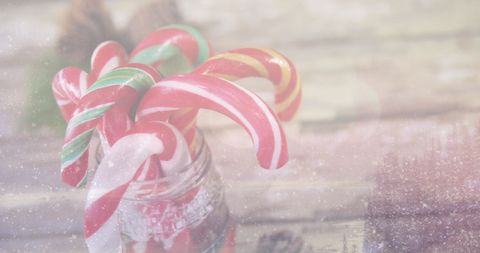 Festive Winter Display with Candy Canes in Snowy Scene