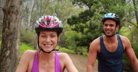Couple Enjoying Nature During Energetic Bike Ride