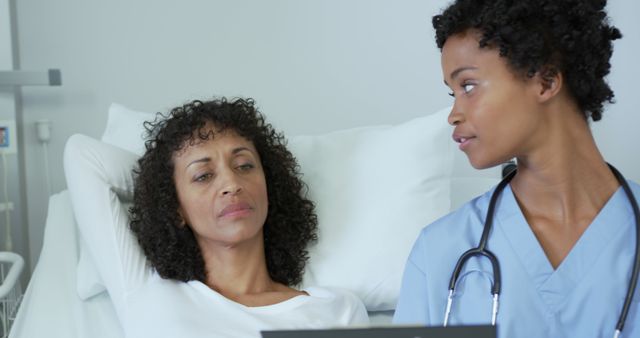 Nurse Consulting Relaxed Patient in Hospital Room - Download Free Stock Images Pikwizard.com