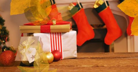 Festive Christmas Gift Boxes by Cozy Fireplace with Warm Decor - Download Free Stock Images Pikwizard.com