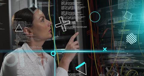 Tech Professional Analyzing Data in Modern Server Room - Download Free Stock Images Pikwizard.com