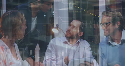 Diverse Professionals Analyzing Digital Data at Office Meeting