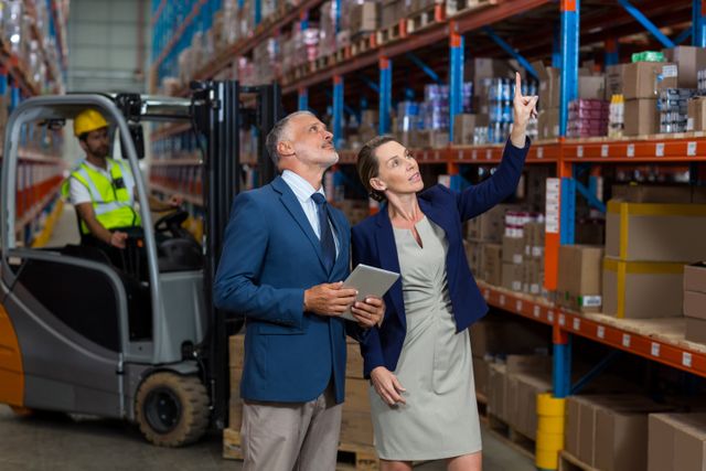 Warehouse manager and client interacting with each other in warehouse