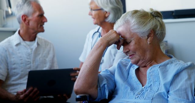 Senior Woman Experiencing Stress in Healthcare Environment - Download Free Stock Images Pikwizard.com