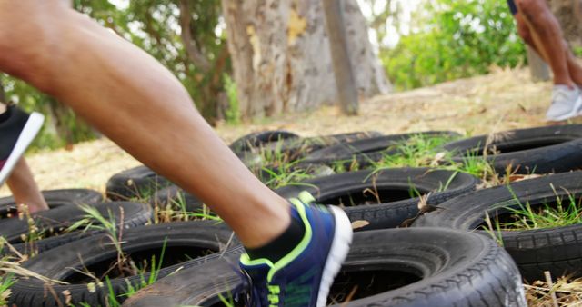 Athletes Running Through Tire Obstacle During Outdoor Training - Download Free Stock Images Pikwizard.com