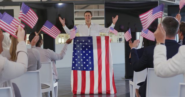 Man Giving Speech Draped in American Flag in Front of Enthusiastic Audience - Download Free Stock Images Pikwizard.com