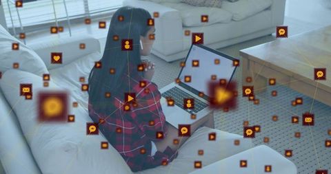 Digital Network Interface Surrounds Woman Using Laptop