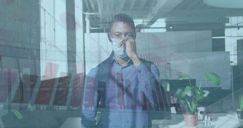 Professional Worker with Face Mask and Analytics Overlay in Office