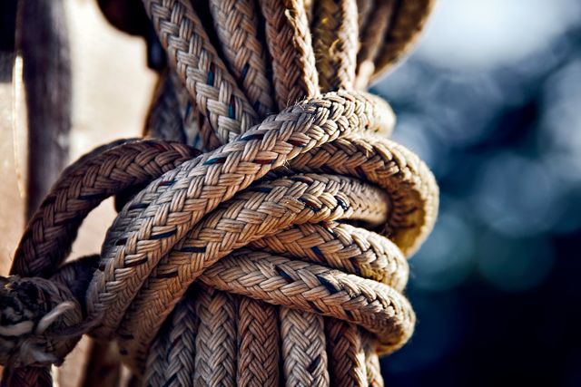 Close-Up of Tightly Knotted Thick Ship Rope Outdoors - Download Free Stock Photos Pikwizard.com