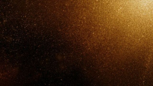 Shimmering golden dust with warm glow