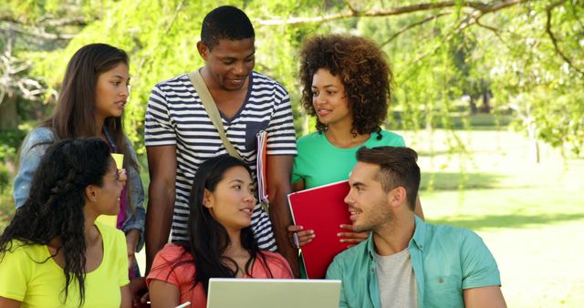 Diverse Students Collaborating Outdoors with Laptop and Notebooks - Download Free Stock Images Pikwizard.com