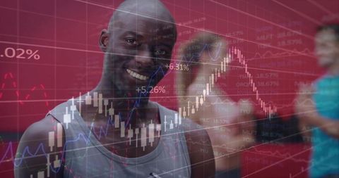 Smiling black athlete wearing gray tank top standing in gym with financial chart overlay