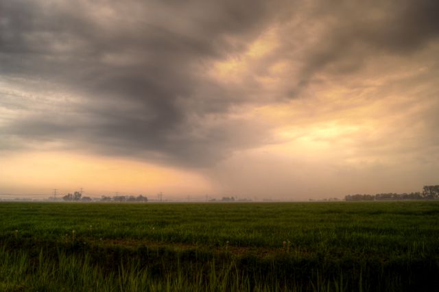 Dutch landscape with local rain - Download Free Stock Photos Pikwizard.com