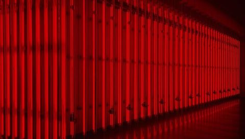 Crimson neon tube corridor reflecting on glossy floor modern minimalist art installation