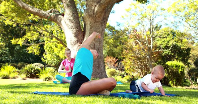 Mother Exercising with Baby in Sunny Park Environment - Download Free Stock Images Pikwizard.com