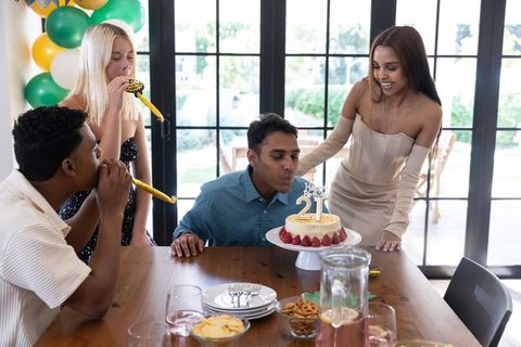 Diverse Friends Celebrating 21st Birthday with Cake and Decorations