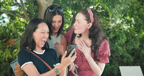 Joyful Diverse Friends Taking Selfies on Vacation