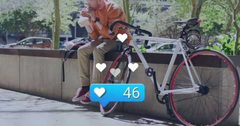 Urban Cyclist Taking a Break with Healthy Snack and Social Engagement