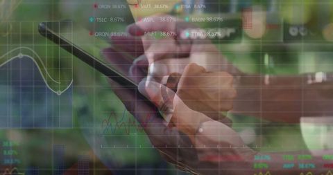 Businesswomen analyzing stock data on tablet outdoors