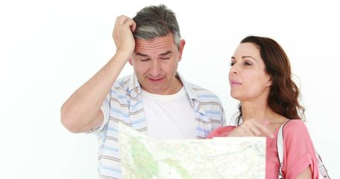 couple puzzled by map, searching for directions - Download Free Stock Images Pikwizard.com