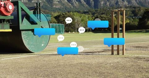 Cricket pitch roller and stumps with chat bubbles representing live match commentary