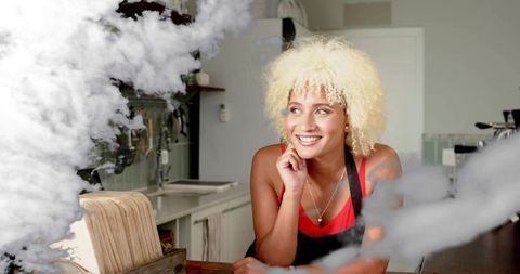 Smiling Cafe Worker Relaxing in Rustic Culinary Setting
