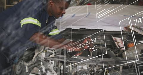 Auto mechanic using tablet with augmented reality diagnostics and HUD overlays on engine