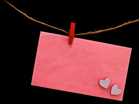 Red Envelope with Hearts on Clothesline for Romantic Messages