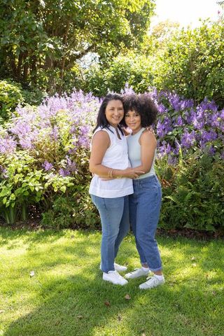 Mother and Daughter Bonding in Beautiful Garden Landscape