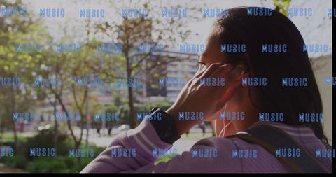 Biracial Woman Enjoying Music in Urban Park