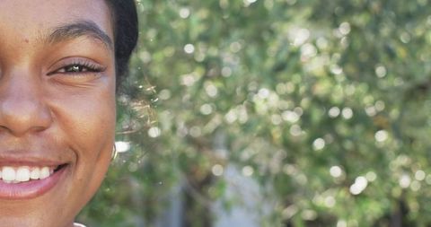 Close Up of Smiling Woman with Nature Background and Copy Space
