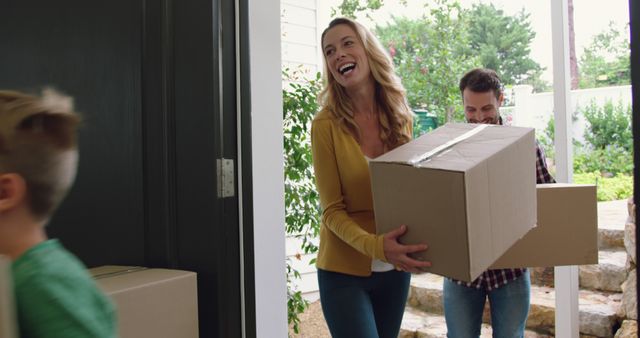 Excited Family Moving Into New Home and Carrying Boxes - Download Free Stock Images Pikwizard.com