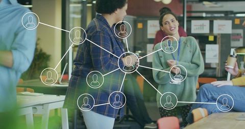 Colleagues Collaborating in a Modern Open-Plan Office