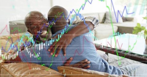 Father and adult son hugging on couch with overlaid stock market and investment charts