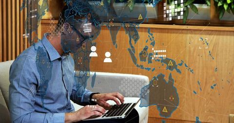 Businessman engaged in interactive global networking