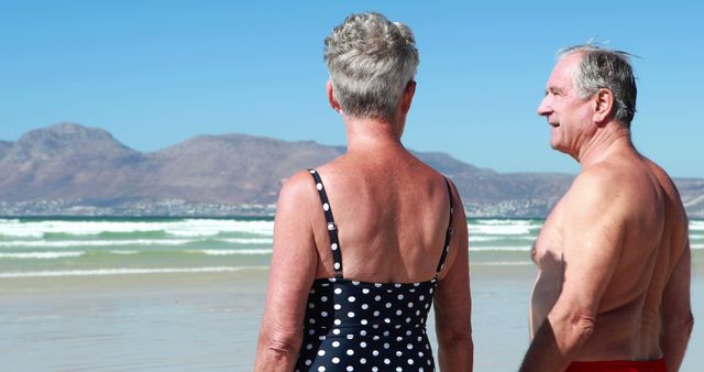 Elderly Couple Enjoying Conversation at the Beach - Download Free Stock Images Pikwizard.com