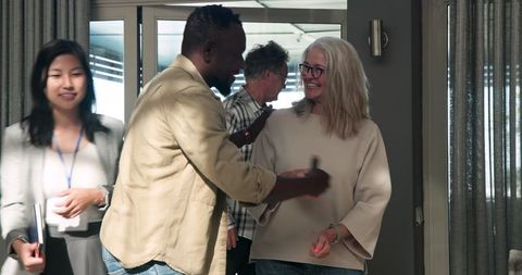 Diverse group happily engaging in therapy session, sharing positive emotions