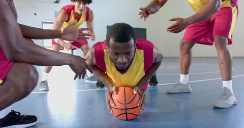 Team Push-Ups on Basketball Showing Strength and Teamwork