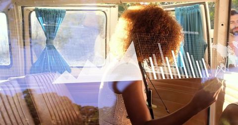 Woman Analyzing Data Overlays in Van with Digital Analytics