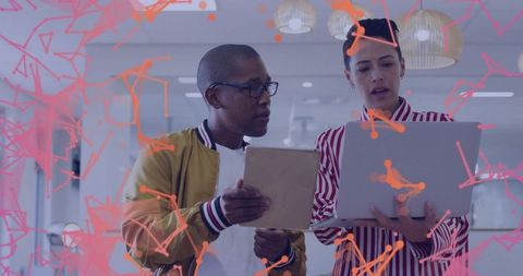 Collaborating Colleagues Analyzing Digital Strategy in Modern Office