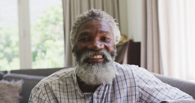 Relaxed Older Man with Beard Smiling at Home - Download Free Stock Images Pikwizard.com